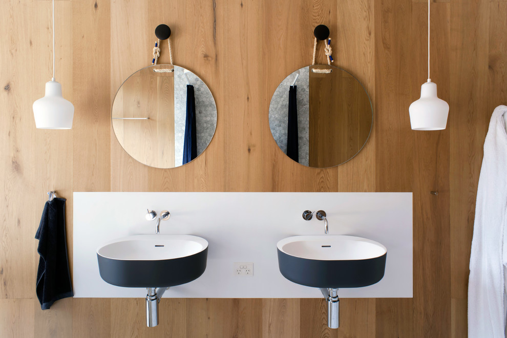 Photo of a contemporary bathroom in Sydney with a wall-mount sink.