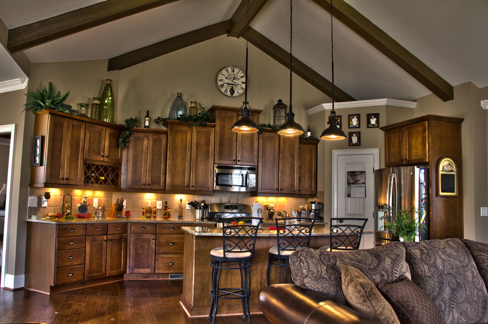Inspiration for a mid-sized transitional u-shaped medium tone wood floor open concept kitchen remodel in Raleigh with a double-bowl sink, shaker cabinets, medium tone wood cabinets, granite countertops, beige backsplash, ceramic backsplash, stainless steel appliances and an island