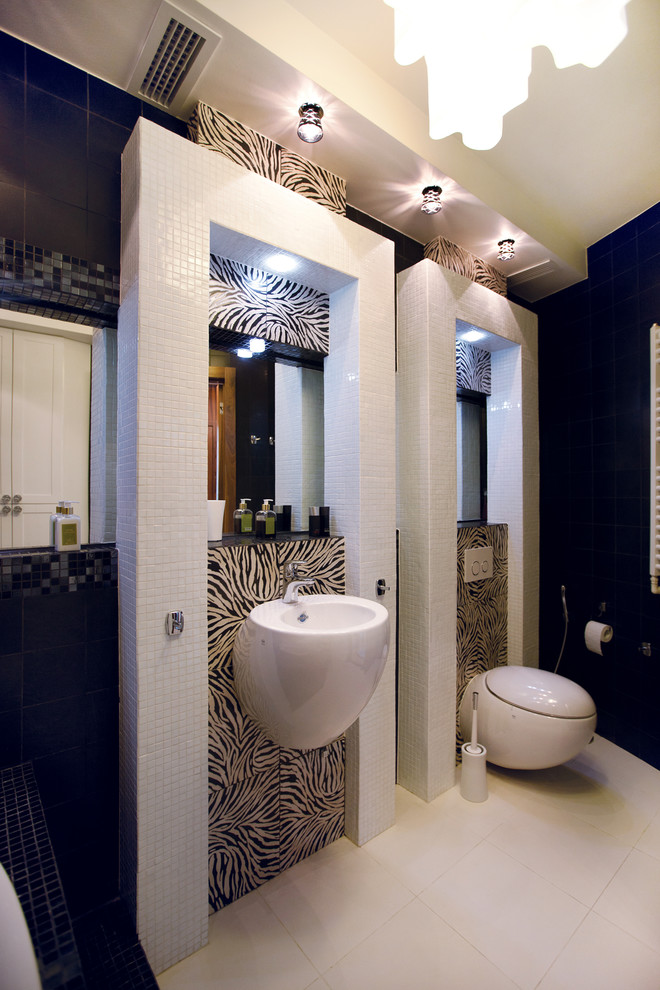 Photo of a small contemporary powder room in Other with a wall-mount toilet and a wall-mount sink.