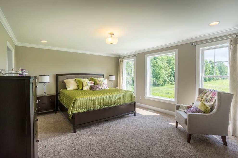 Large traditional master bedroom in New York with beige walls, carpet, no fireplace and beige floor.