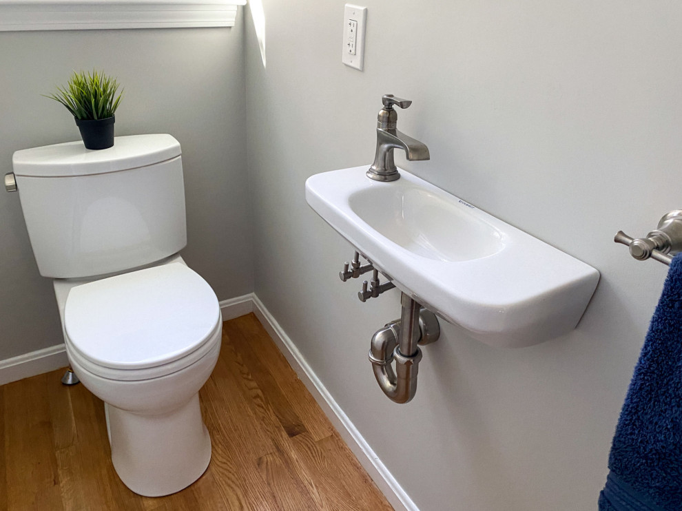 This is an example of a transitional powder room in Boston.