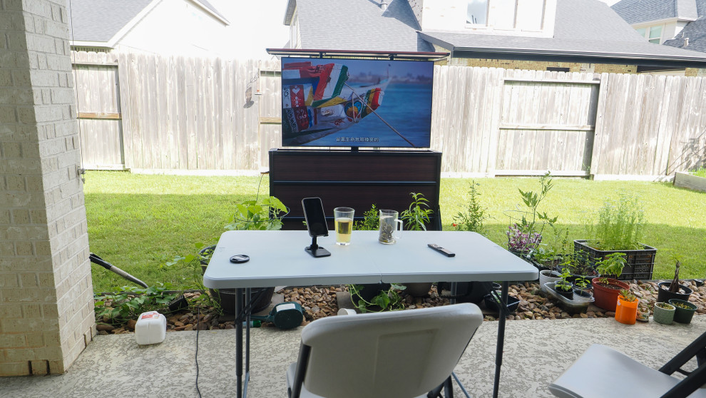 The front of the Chicago outdoor TV lift cabinet with a TV picture