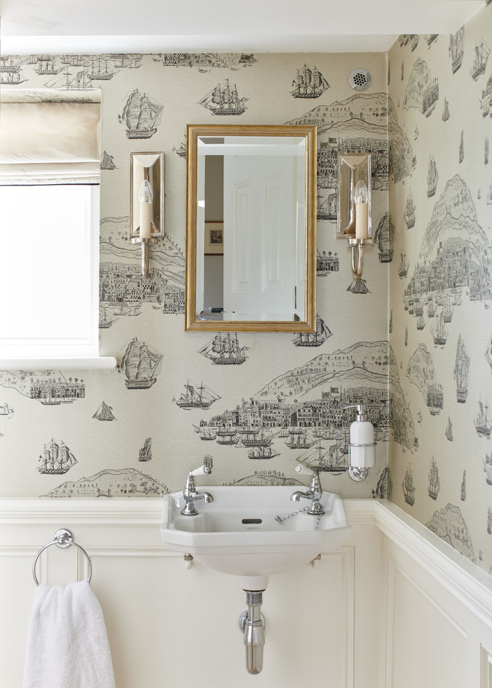 Traditional powder room in Other with multi-coloured walls and a wall-mount sink.