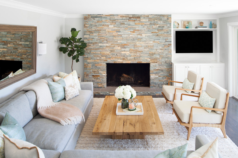 Inspiration for a mid-sized transitional living room in Sacramento with grey walls, dark hardwood floors, brown floor, a standard fireplace, a stone fireplace surround and a built-in media wall.
