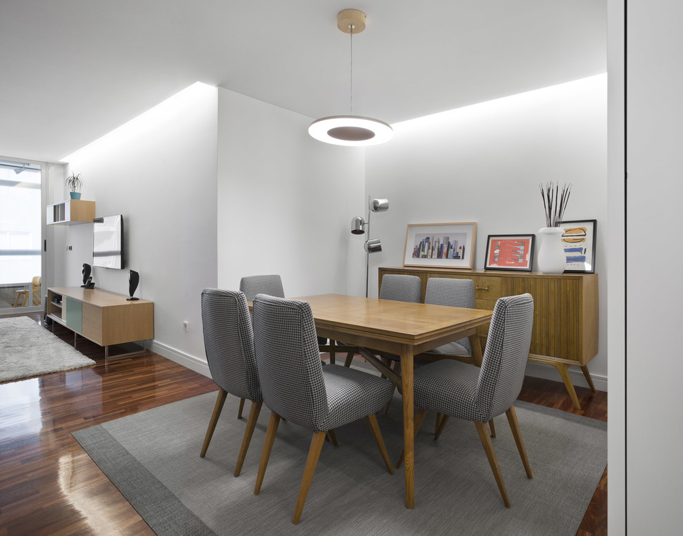 Photo of a contemporary dining room in Other with white walls, dark hardwood floors and brown floor.
