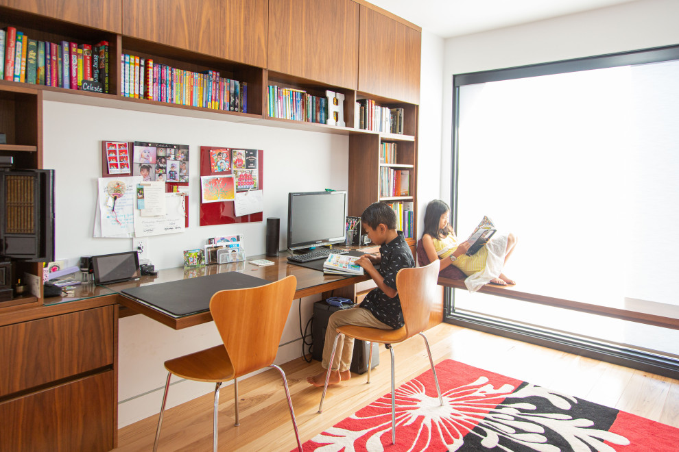 Inspiration for a contemporary light wood floor kids' room remodel in Other with white walls