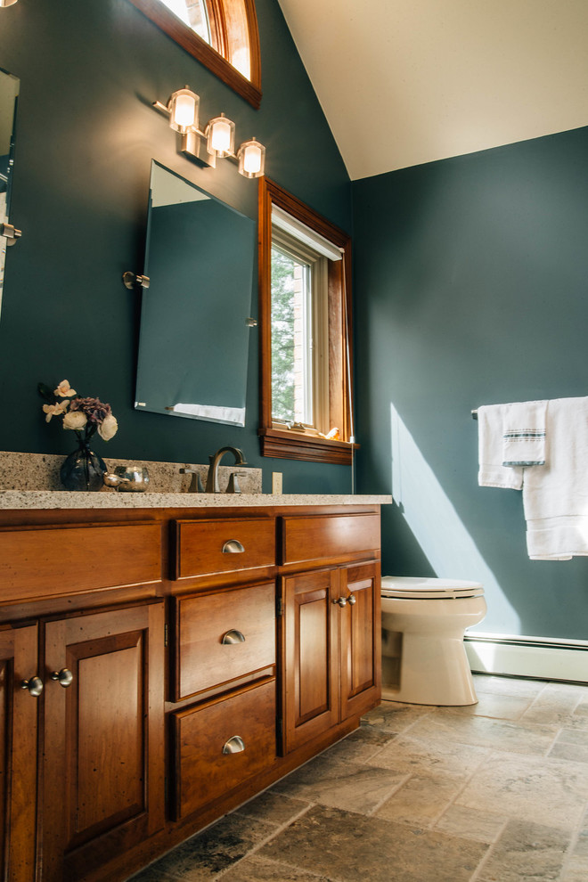 Photo of a mid-sized transitional master bathroom in Other with raised-panel cabinets, dark wood cabinets, an alcove tub, a shower/bathtub combo, beige tile, travertine, green walls, travertine floors, an undermount sink, granite benchtops, beige floor, a shower curtain and grey benchtops.