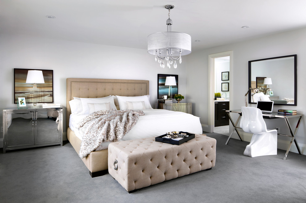 This is an example of a contemporary master bedroom in Toronto with carpet.