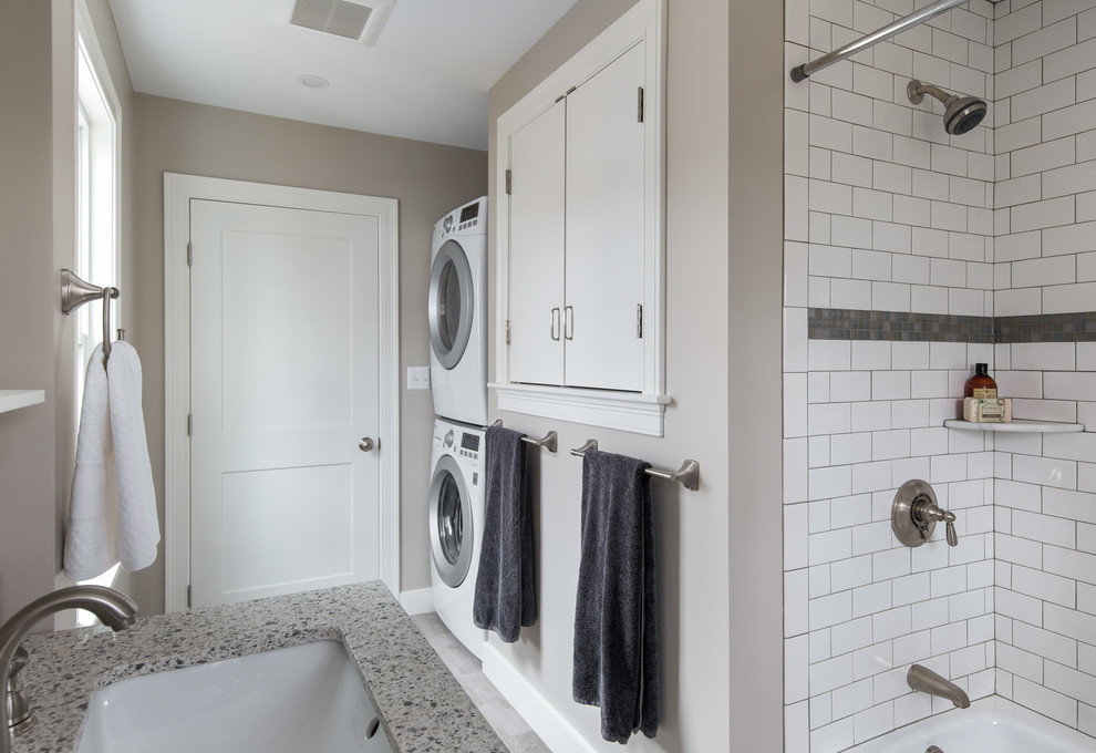 Mid-sized transitional master white tile and subway tile porcelain tile and gray floor alcove bathtub photo in Boston with shaker cabinets, white cabinets, a one-piece toilet, gray walls, an undermount sink and quartz countertops