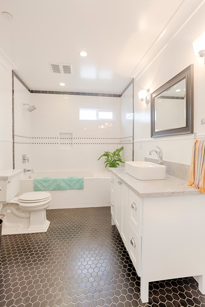 Design ideas for a traditional bathroom in Other with a vessel sink, shaker cabinets, white cabinets, marble benchtops, white tile, ceramic tile, white walls, ceramic floors, an alcove tub, a shower/bathtub combo and a two-piece toilet.