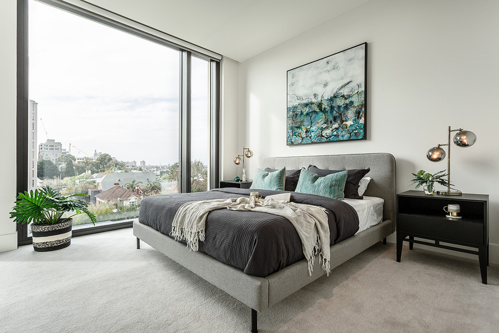Inspiration for a mid-sized contemporary master bedroom in Melbourne with white walls, carpet and grey floor.