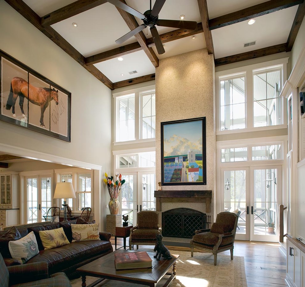 Photo of a country living room in Charleston with a standard fireplace.