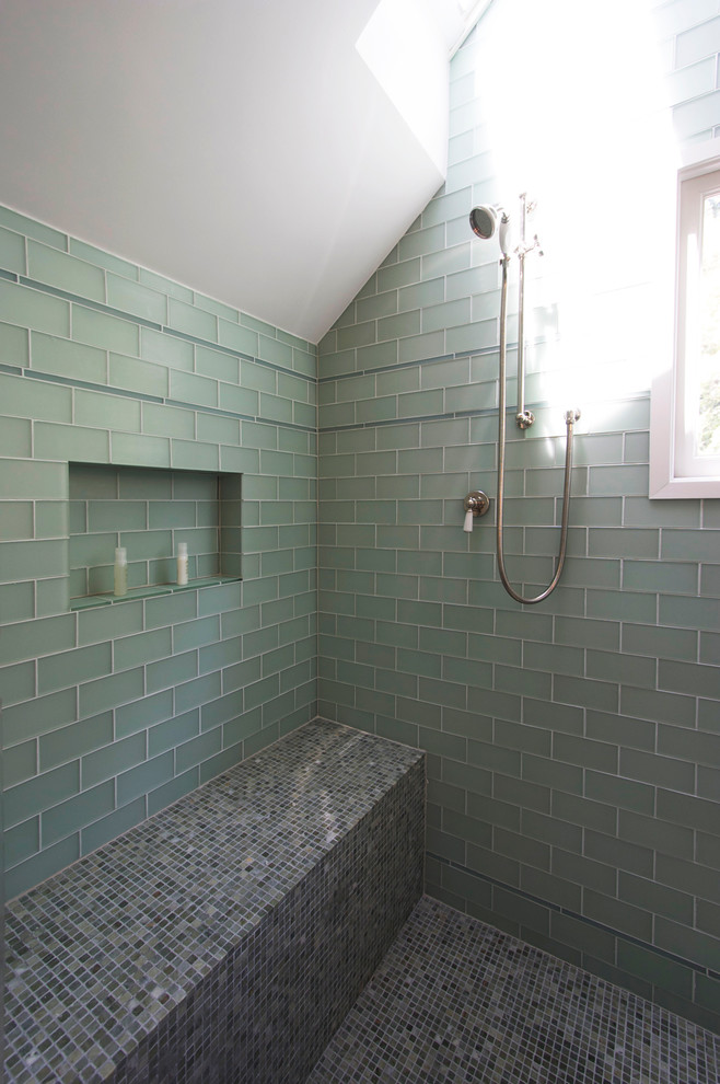 This is an example of a mid-sized contemporary master bathroom in San Francisco with glass-front cabinets, white cabinets, a corner shower, a two-piece toilet, subway tile, blue walls and dark hardwood floors.