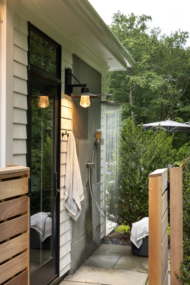 Photo of a traditional patio in New York with an outdoor shower and no cover.