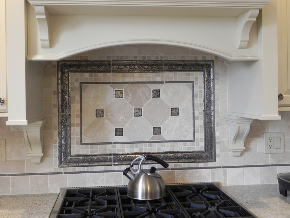 Example of a mid-sized transitional kitchen design with raised-panel cabinets, white cabinets, beige backsplash, subway tile backsplash and stainless steel appliances