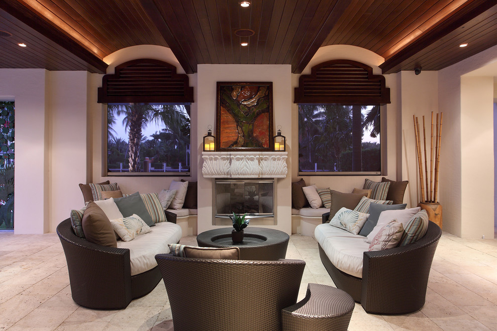This is an example of a mediterranean verandah in Miami with a fire feature.