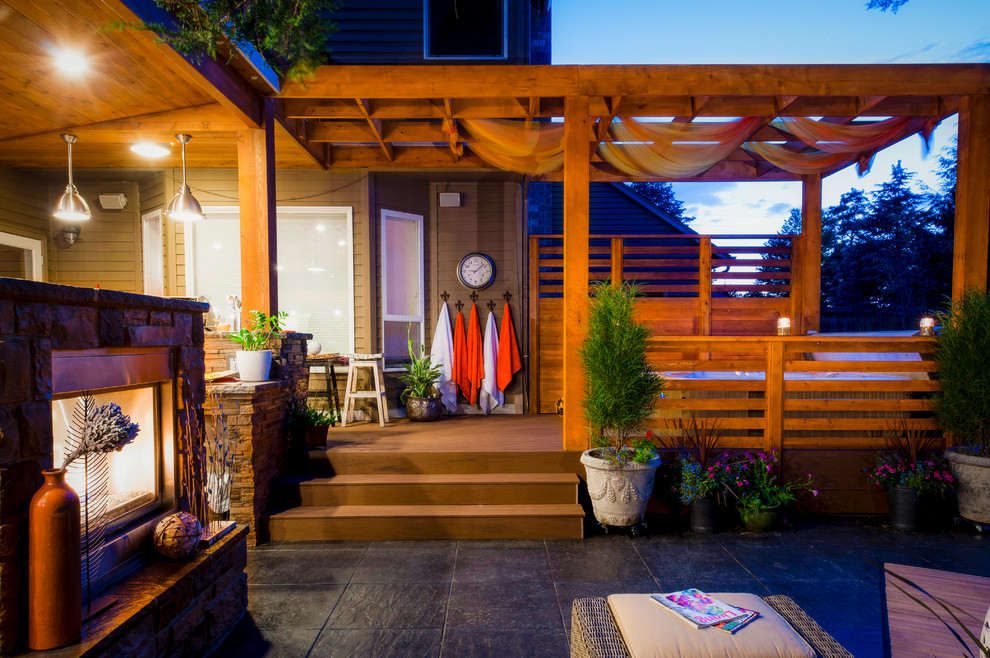 Contemporary patio in Portland with a fire feature and decking.