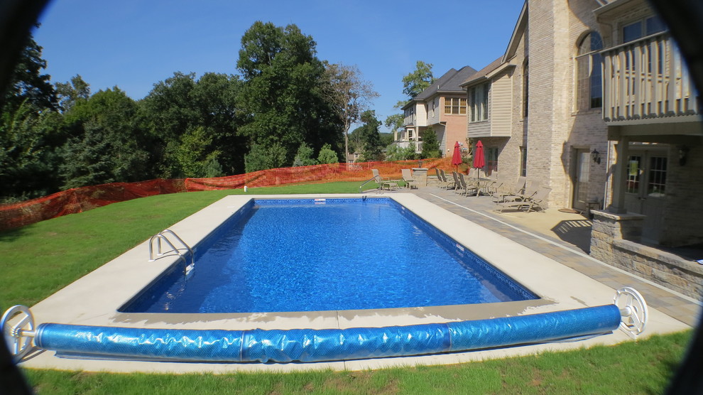 Pool - large modern backyard stamped concrete and rectangular pool idea