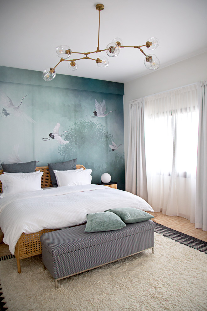 This is an example of an eclectic guest bedroom in Other with wallpapered walls.