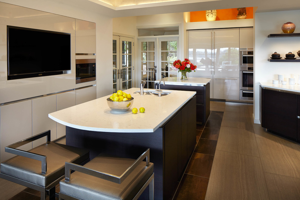 Inspiration for a large transitional ceramic tile and gray floor eat-in kitchen remodel in Seattle with quartzite countertops, stainless steel appliances, two islands, white countertops, an undermount sink, flat-panel cabinets and dark wood cabinets