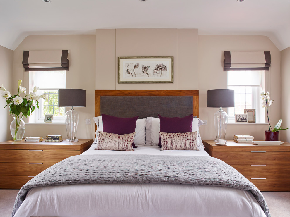 Transitional bedroom in Surrey with beige walls and carpet.