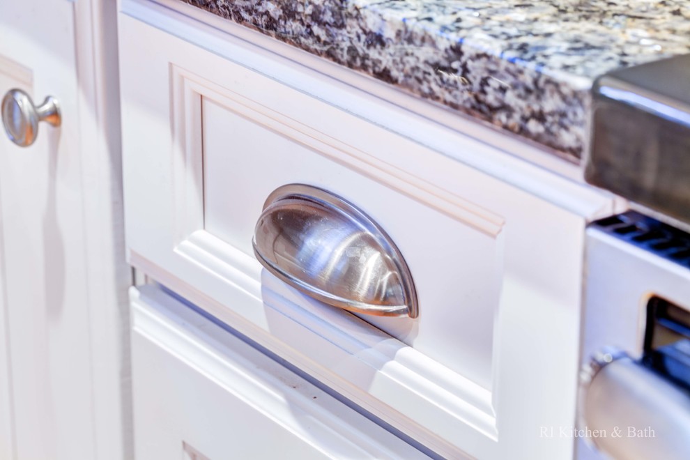 Large transitional u-shaped medium tone wood floor eat-in kitchen photo in Providence with an undermount sink, shaker cabinets, white cabinets, granite countertops, blue backsplash, stone tile backsplash, stainless steel appliances and an island