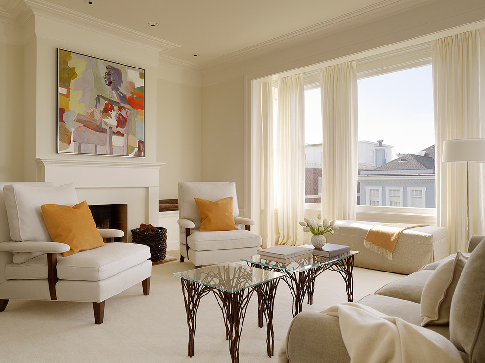 This is an example of a mid-sized contemporary living room in San Francisco with beige walls and a standard fireplace.