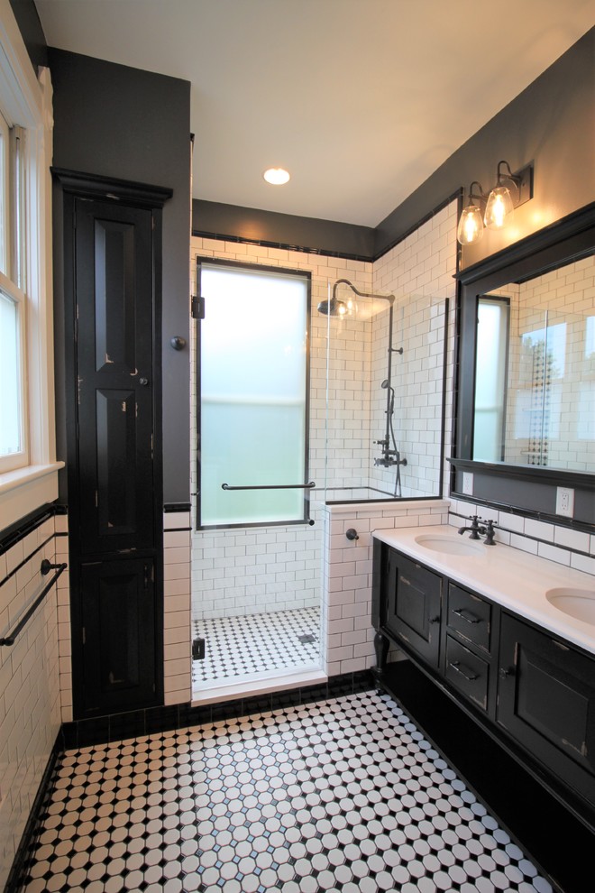 Inspiration for a mid-sized traditional master bathroom in Indianapolis with furniture-like cabinets, black cabinets, a two-piece toilet, white tile, grey walls, an undermount sink, engineered quartz benchtops, a hinged shower door, white benchtops, ceramic tile, porcelain floors and multi-coloured floor.