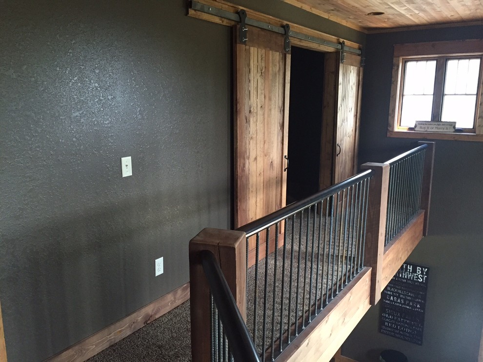 Home design - mid-sized rustic carpeted home design idea with brown walls