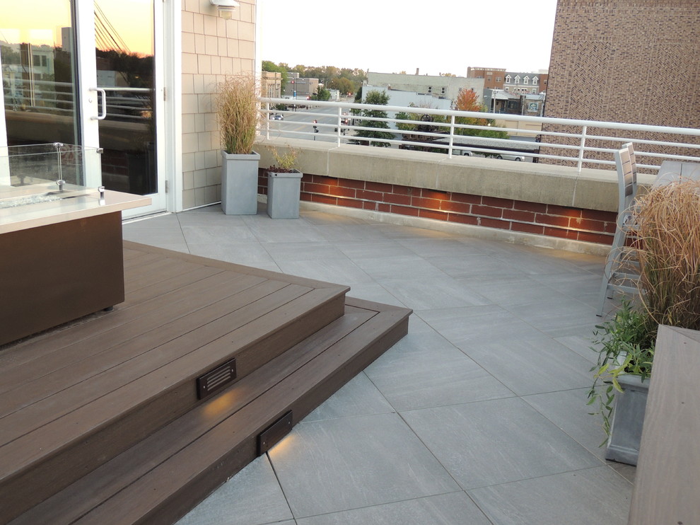 Balcony - small modern metal railing balcony idea with a fire pit