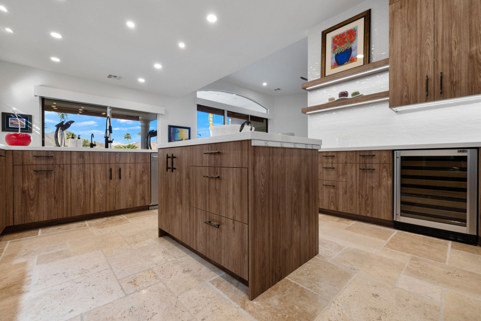 Example of a mountain style l-shaped slate floor and beige floor enclosed kitchen design with a single-bowl sink, flat-panel cabinets, medium tone wood cabinets, quartzite countertops, white backsplash, glass sheet backsplash, stainless steel appliances, a peninsula and white countertops