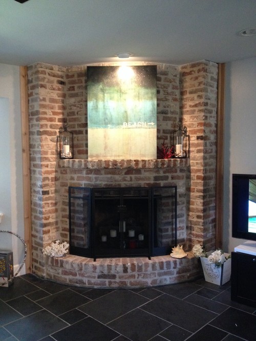 Curved fireplace I have a corner fireplace that is curved and original 1960s brick from floor to ceiling. We recently had the flooring replaced to a dark slate. I would like to have a dark stained cedar rustic look mantel added but the curve may make it difficult. Any ideas on this design and how I could tackle this...