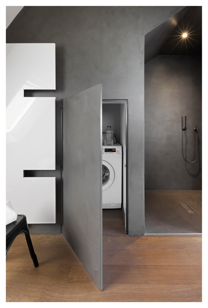 Design ideas for a mid-sized industrial 3/4 bathroom in Frankfurt with flat-panel cabinets, grey cabinets, a curbless shower, a two-piece toilet, grey walls, dark hardwood floors, a console sink, solid surface benchtops, brown floor, an open shower, white benchtops, a niche, a single vanity, a floating vanity, wallpaper and wallpaper.