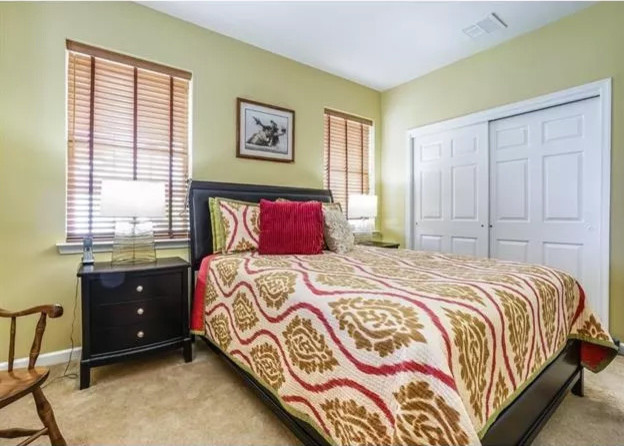 Bedroom - mid-sized transitional master carpeted and brown floor bedroom idea with green walls and no fireplace