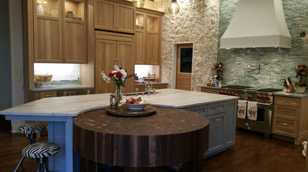 Open concept kitchen - transitional dark wood floor open concept kitchen idea with a farmhouse sink, blue backsplash, glass tile backsplash and white countertops