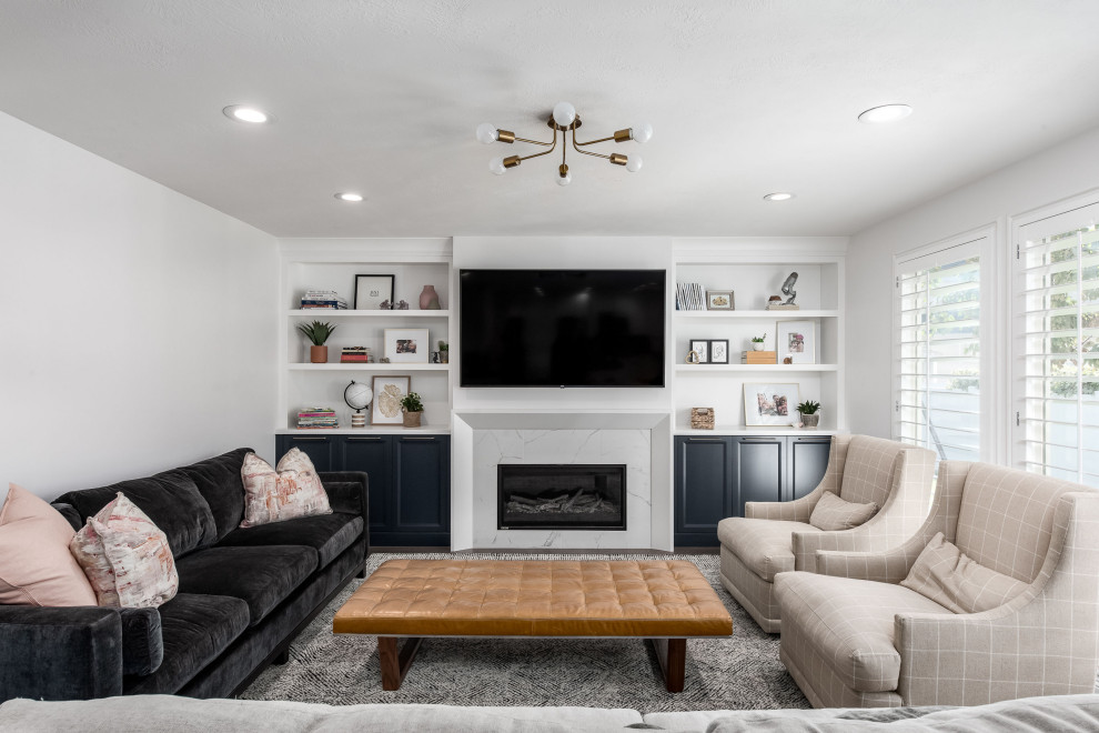 This is an example of a mid-sized transitional open concept family room in Salt Lake City with white walls, dark hardwood floors, a standard fireplace, a stone fireplace surround, a wall-mounted tv and brown floor.