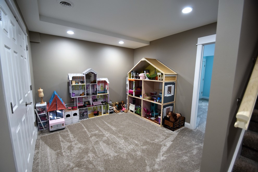 Inspiration for a mid-sized transitional gender-neutral kids' playroom for kids 4-10 years old in Milwaukee with grey walls, carpet and brown floor.