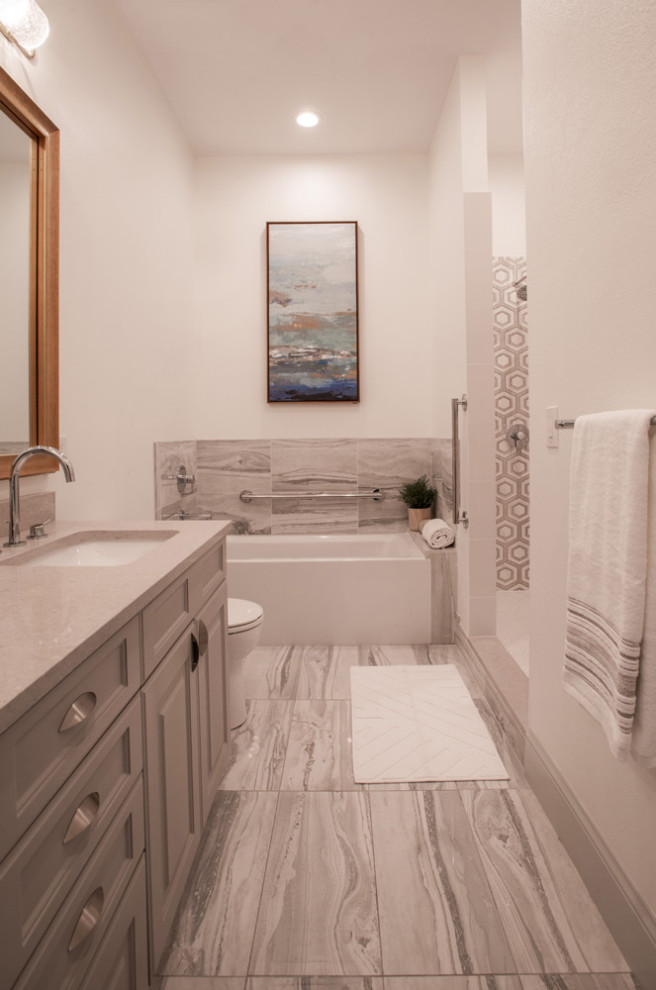 Example of a mid-sized trendy master single-sink wet room design in Santa Barbara with a one-piece toilet, beige walls, an undermount sink and a hinged shower door