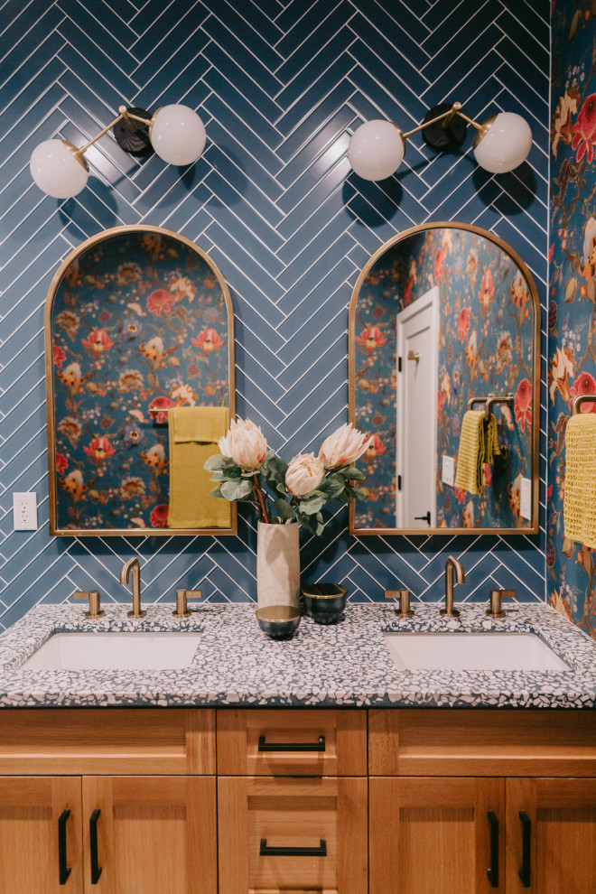 Mid-sized eclectic kids bathroom in Los Angeles with light wood cabinets, an alcove shower, blue tile, glass tile, multi-coloured walls, ceramic floors, an undermount sink, blue floor, a hinged shower door, multi-coloured benchtops, a niche, a double vanity, a built-in vanity and wallpaper.