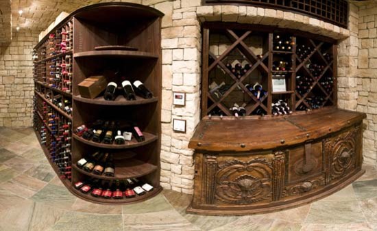 This is an example of a mid-sized modern wine cellar in Kansas City with display racks.
