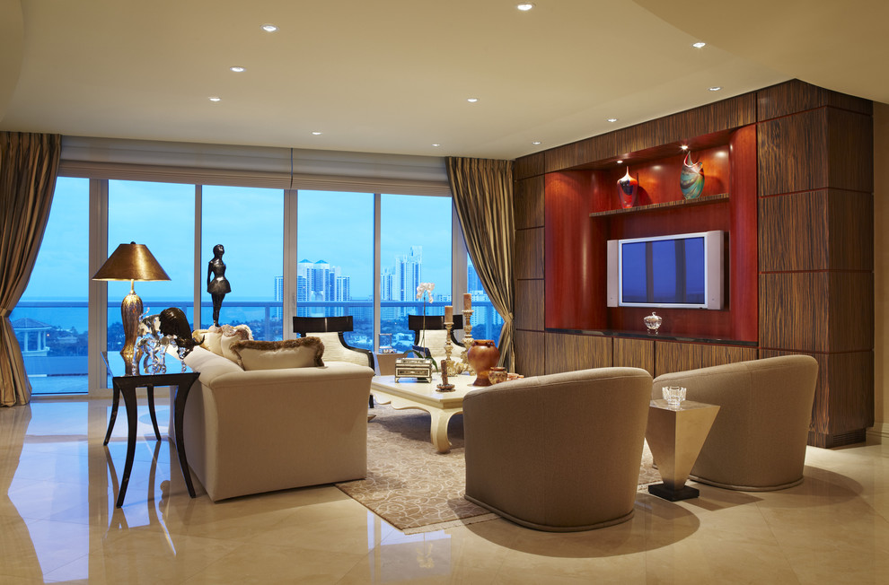 Large contemporary formal open concept living room in Miami with beige walls, marble floors and a built-in media wall.