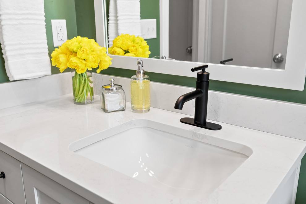Small white tile and ceramic tile porcelain tile, gray floor and single-sink corner bathtub photo with white cabinets, a bidet, green walls, an undermount sink, white countertops and a built-in vanity