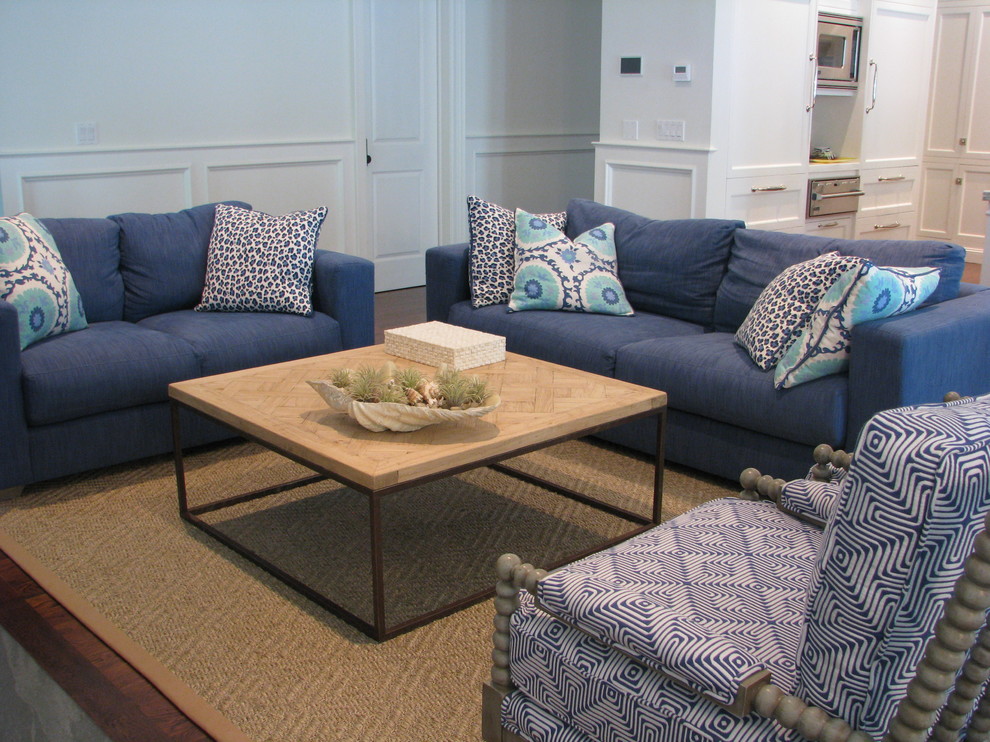 Example of a large beach style open concept medium tone wood floor and brown floor family room design in New York with white walls