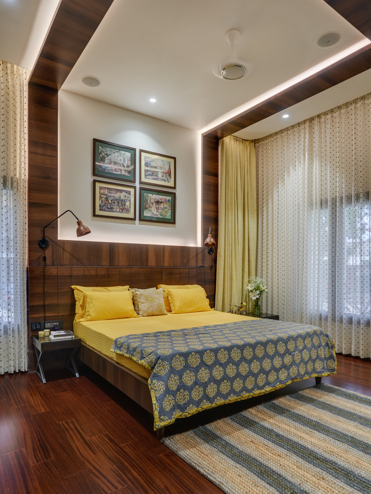 This is an example of a transitional bedroom in Bengaluru.