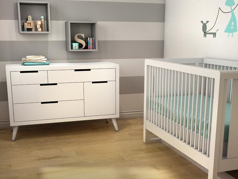 Photo of a scandinavian nursery for boys in New York with plywood floors and multi-coloured walls.