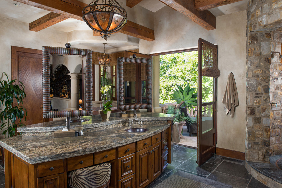 Photo of a mediterranean bathroom in San Diego with an undermount sink, raised-panel cabinets, medium wood cabinets, an open shower, beige walls and an open shower.