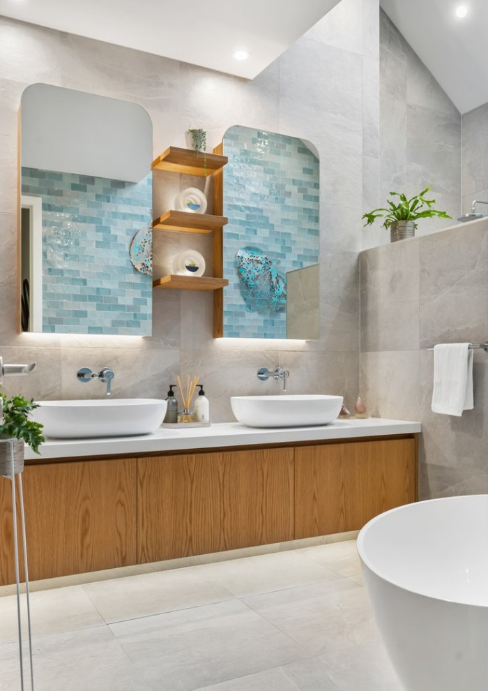 Photo of a large modern master wet room bathroom in Perth with furniture-like cabinets, grey cabinets, a freestanding tub, a one-piece toilet, multi-coloured tile, stone slab, blue walls, porcelain floors, a vessel sink, engineered quartz benchtops, grey floor, an open shower, white benchtops, a double vanity, a floating vanity, exposed beam and planked wall panelling.