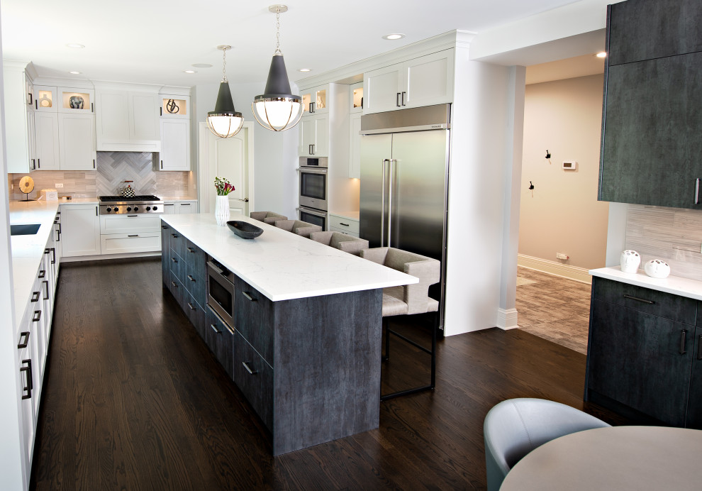 Large transitional medium tone wood floor and brown floor eat-in kitchen photo in Chicago with an integrated sink, shaker cabinets, white cabinets, quartz countertops, gray backsplash, porcelain backsplash, black appliances, an island and white countertops