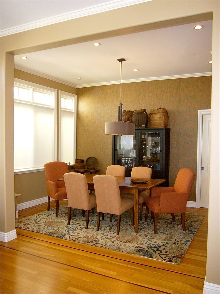 This is an example of a mid-sized asian separate dining room in San Francisco with brown walls and medium hardwood floors.