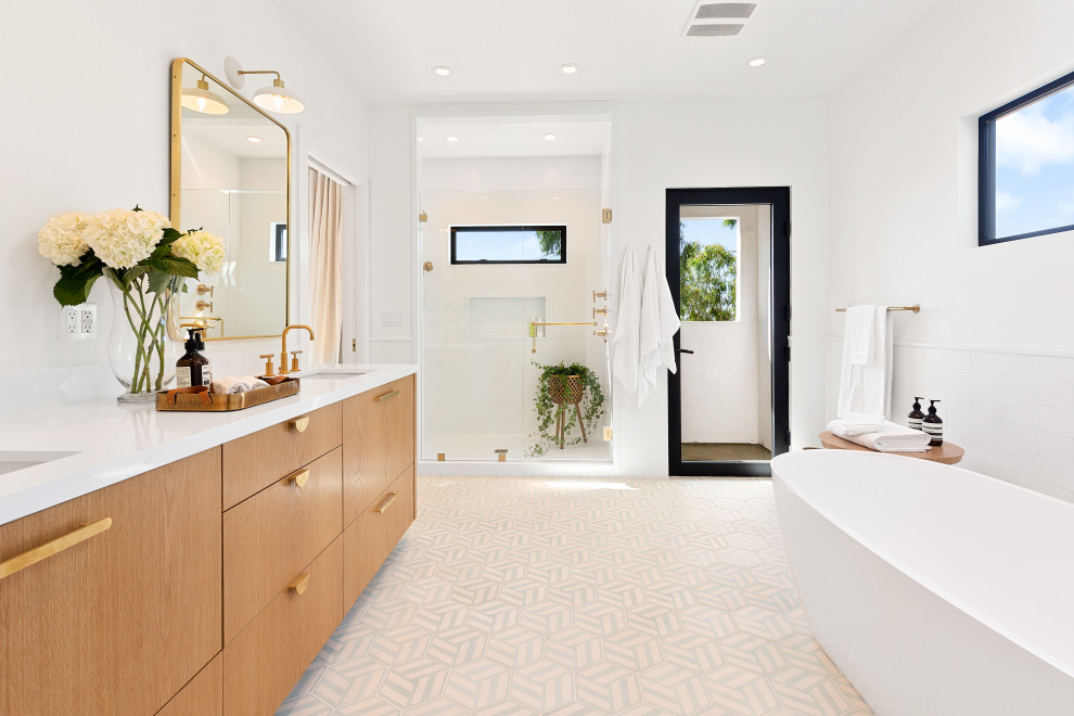 Large contemporary master bathroom in Los Angeles with flat-panel cabinets, medium wood cabinets, a freestanding tub, an open shower, a two-piece toilet, white tile, porcelain tile, white walls, ceramic floors, an undermount sink, grey floor, an open shower, white benchtops, engineered quartz benchtops, a niche, a double vanity and a built-in vanity.